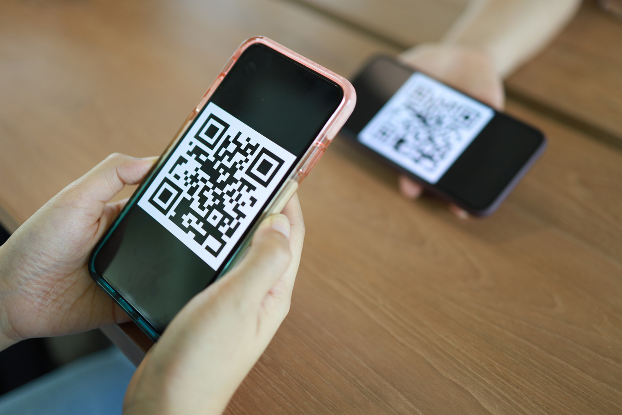 Qr code payment. Woman scanning QR code online shopping cashless